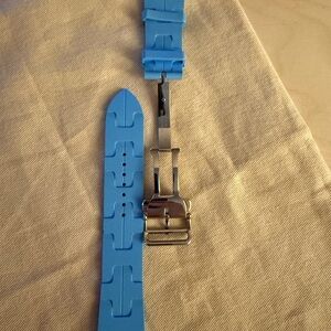Apple Hermes watch bands.  Kilim band in light blue & solo loop in Orange.